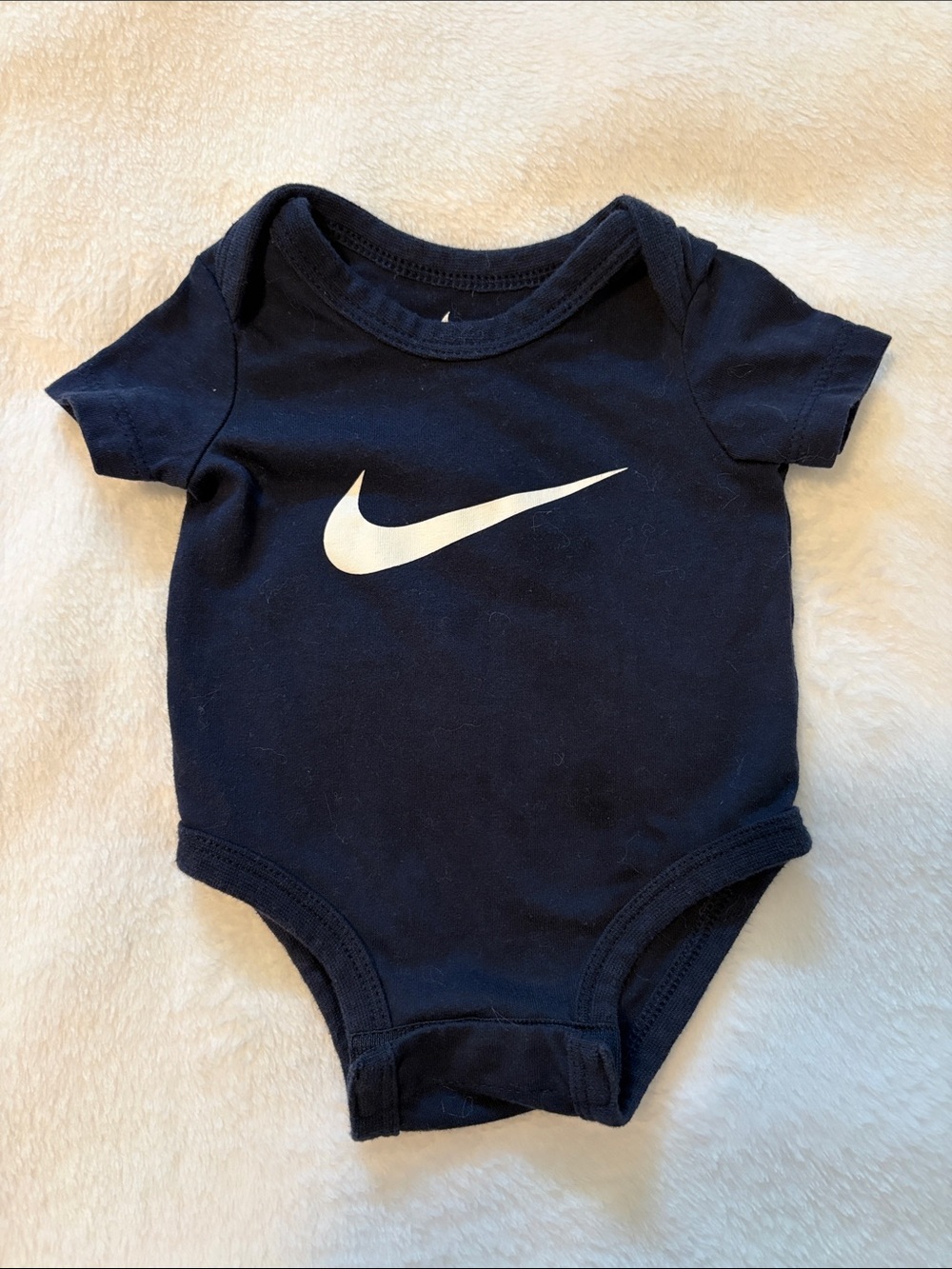 Nike newborn Navy One-Piece Bodysuit with White Swoosh
